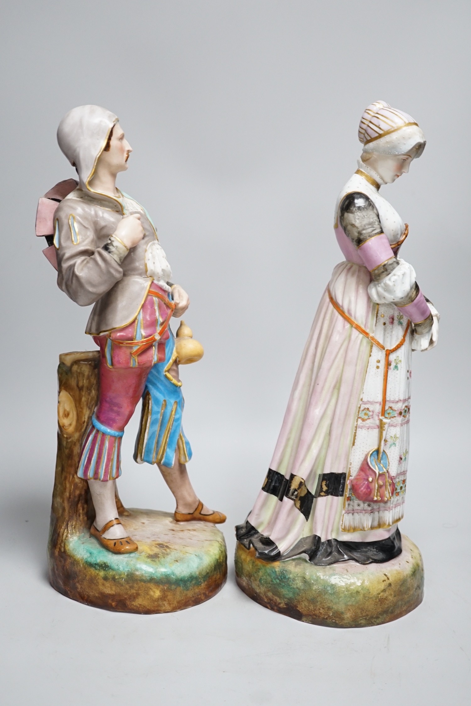A pair of large Paris porcelain figures of a gentleman and a lady, lady 41cms high